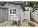 Charming outdoor setup with a sink and shower next to the building at 1510 W Powhatan Ave, Tampa, FL 33603