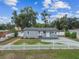 Beautifully maintained home with a white picket fence and mature trees at 1510 W Powhatan Ave, Tampa, FL 33603