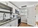 Renovated kitchen featuring granite countertops and stainless appliances at 1510 W Powhatan Ave, Tampa, FL 33603