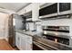Updated kitchen featuring stainless steel appliances and granite counters at 1510 W Powhatan Ave, Tampa, FL 33603