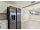 Modern kitchen with stainless steel fridge adjacent to the eat-in dining room at 1510 W Powhatan Ave, Tampa, FL 33603