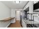 Bright updated kitchen featuring white cabinets and stainless steel appliances at 1510 W Powhatan Ave, Tampa, FL 33603