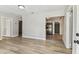 Bright living room showcasing modern flooring and an open doorway into the kitchen at 1510 W Powhatan Ave, Tampa, FL 33603
