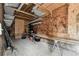 Shed interior with plywood walls and shelving units, tools, and table at 1510 W Powhatan Ave, Tampa, FL 33603
