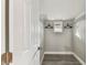 Bright walk-in closet featuring wire shelving, a small window, and neutral paint, perfect for organization at 1510 W Powhatan Ave, Tampa, FL 33603