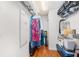 Walk-in closet with shelving, hanging storage, and hardwood floors for organized storage at 1731 W Watrous Ave # 202, Tampa, FL 33606