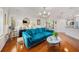 Open living space with hardwood floors features plantation shutters and doorway leading into the kitchen at 1731 W Watrous Ave # 202, Tampa, FL 33606