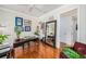 Bright office with a ceiling fan, a desk with plants and sports memorabilia displayed throughout the room at 1731 W Watrous Ave # 202, Tampa, FL 33606