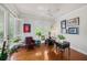 Bright office with hardwood floors, ceiling fan, plantation shutters, and plenty of natural light at 1731 W Watrous Ave # 202, Tampa, FL 33606