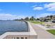 Beautiful waterfront view with a walkway, lush greenery, and a distant skyline providing scenic backdrop at 1731 W Watrous Ave # 202, Tampa, FL 33606