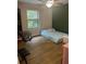 Bedroom with a pet and large window providing views of the outdoors at 17361 Old Tobacco Rd, Lutz, FL 33558