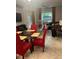 Open living room and dining area with large windows at 17361 Old Tobacco Rd, Lutz, FL 33558