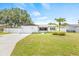 Charming single-Gathering home with a manicured lawn, attached garage, and a welcoming facade at 1901 76Th N Ave, St Petersburg, FL 33702