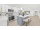 Modern kitchen with an island, stainless steel appliances, and a neutral color scheme for a clean aesthetic at 1901 76Th N Ave, St Petersburg, FL 33702