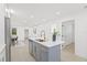 Bright, open kitchen showcasing a stylish island with sink, modern finishes and stainless steel appliances at 1901 76Th N Ave, St Petersburg, FL 33702