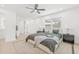Spacious main bedroom with a comfortable bed, modern decor, and plenty of natural light at 1901 76Th N Ave, St Petersburg, FL 33702