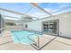 Screened-in outdoor pool area with a covered pool at 1901 76Th N Ave, St Petersburg, FL 33702