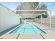 Screened-in pool with a clear blue water and covered deck area, perfect for relaxation and entertaining at 1901 76Th N Ave, St Petersburg, FL 33702