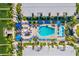 Aerial view of pool, lounge chairs, and surrounding waterfront property at 19417 Gulf Blvd # B110, Indian Rocks Beach, FL 33785