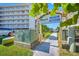 Inviting beach access framed by tropical foliage, steps away from the resort, and close to the building at 19417 Gulf Blvd # B110, Indian Rocks Beach, FL 33785