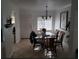 Bright dining room with glass top table and seating for six is perfect for a sit down meal with friends at 19417 Gulf Blvd # B110, Indian Rocks Beach, FL 33785