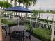 Outdoor lanai with seating for four is perfect for a relaxing afternoon at 19417 Gulf Blvd # B110, Indian Rocks Beach, FL 33785