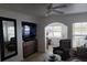 Comfortable living room with tile flooring and large mirror to bring in more natural light at 19417 Gulf Blvd # B110, Indian Rocks Beach, FL 33785