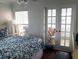 Bright main bedroom with french doors leading to the lanai at 19417 Gulf Blvd # B110, Indian Rocks Beach, FL 33785