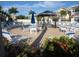 Resort-style pool area surrounded by lounge chairs and lush landscaping at 19417 Gulf Blvd # B110, Indian Rocks Beach, FL 33785