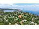 Stunning aerial view showcasing lush neighborhood, bay views, and ideal coastal living location at 211 60Th S Ave, St Petersburg, FL 33705