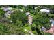Aerial view of the house nestled among lush greenery in a quiet neighborhood at 211 60Th S Ave, St Petersburg, FL 33705
