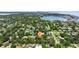 Aerial view of home in lush area near bay and city skyline at 211 60Th S Ave, St Petersburg, FL 33705