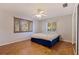 Bedroom with parquet floors, ceiling fan and window with wooden shutters at 211 60Th S Ave, St Petersburg, FL 33705