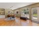 Bright dining area with large windows offering views of the landscaped backyard and patio at 211 60Th S Ave, St Petersburg, FL 33705