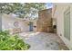 Charming front entrance featuring stone accents, an artistic sculpture, and a cozy bench at 211 60Th S Ave, St Petersburg, FL 33705