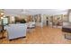 Bright living room featuring hardwood floors, a decorative fireplace, and custom built-in shelving at 211 60Th S Ave, St Petersburg, FL 33705