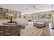 Spacious living room features hardwood floors, custom built-ins, and plenty of natural light at 211 60Th S Ave, St Petersburg, FL 33705