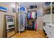 Walk-in closet with wooden parquet floors and ample storage and shelving at 211 60Th S Ave, St Petersburg, FL 33705