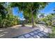 Lush backyard with stepping stone walkway, mature trees, beautiful landscaping, and tranquil fountain at 2201 Horan S Way, Gulfport, FL 33707
