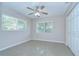 Simple bedroom with neutral paint, a ceiling fan, and a closet at 2201 Horan S Way, Gulfport, FL 33707