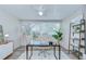 Bright home office featuring a ceiling fan, large windows, and modern decor at 2201 Horan S Way, Gulfport, FL 33707