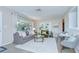 Bright living room with a large window, built-in shelving, and comfortable seating, creating an inviting space at 2201 Horan S Way, Gulfport, FL 33707