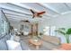 Cozy living room with a ceiling fan, couch, and decor, leading to the dining room at 2201 Horan S Way, Gulfport, FL 33707