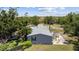 Aerial view of home showcasing backyard, landscaping, surrounding neighborhood, and nearby amenities at 2221 W Lake Dr, Wimauma, FL 33598
