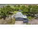 Aerial view of a home showcasing its expansive lot, patio, screened in porch and peaceful backyard setting at 2221 W Lake Dr, Wimauma, FL 33598