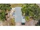 Aerial view of home showing detailed backyard with garden and patio areas at 2221 W Lake Dr, Wimauma, FL 33598