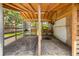 Interior view of a barn with wooden beams and open stalls, ideal for horses or livestock at 2221 W Lake Dr, Wimauma, FL 33598