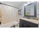 Cozy bathroom featuring a shower-tub combination and updated vanity with modern fixtures at 2221 W Lake Dr, Wimauma, FL 33598