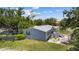 Charming single-Gathering home featuring a well-maintained lawn, a cozy deck, and a tranquil backyard setting at 2221 W Lake Dr, Wimauma, FL 33598