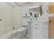 Modern bathroom featuring a sleek vanity, toilet, shower with glass door and neutral color palette at 2240 Pinewood Villas Dr, Holiday, FL 34691